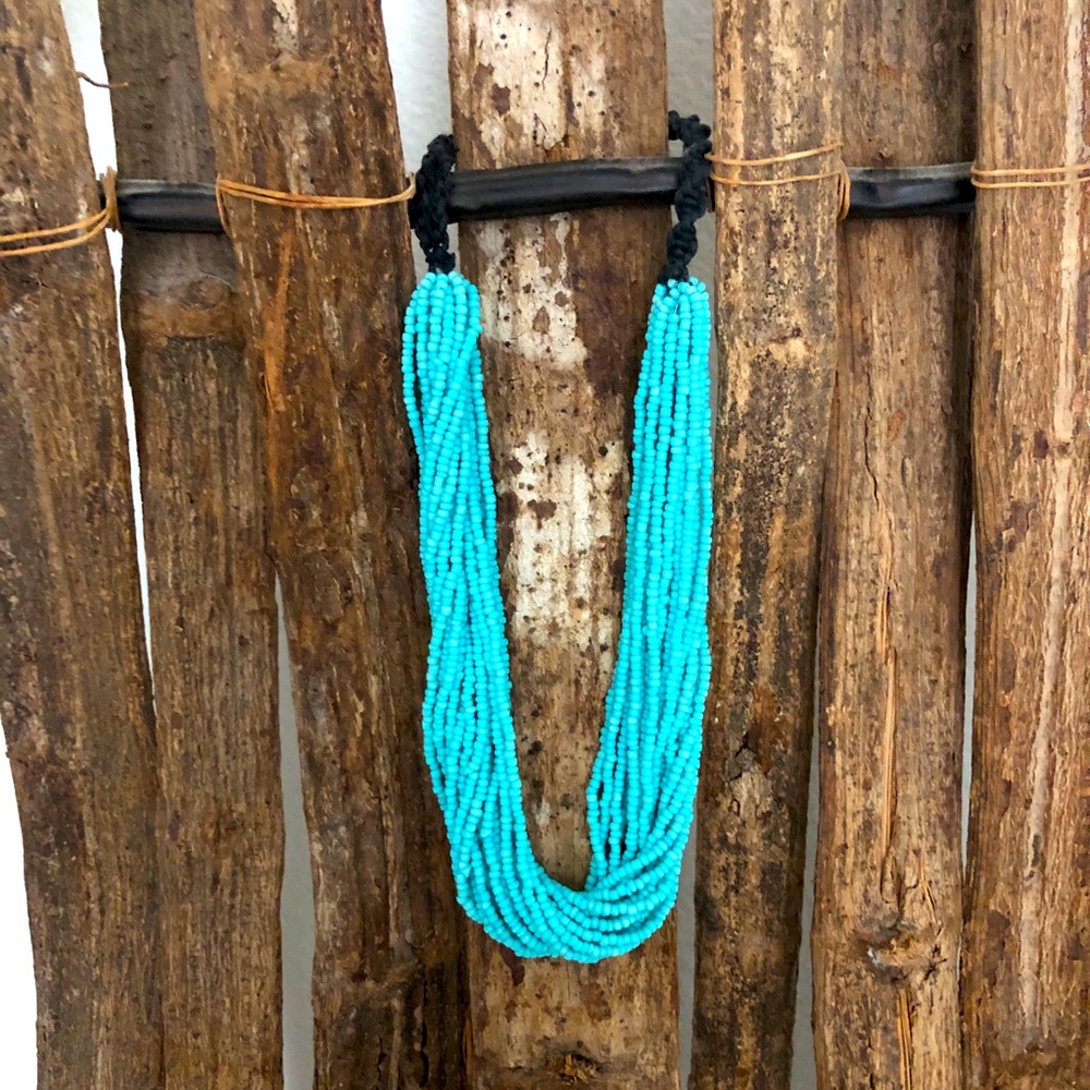 Turquoise bead multi strand necklace with button closure.  Choker style. 18”